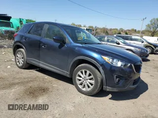 2014 Mazda CX-5 Touring with VIN JM3KE4CY4E0407868, listed as a Copart auction lot 52564315 with 137,989 mi miles and Salvage Title. Bid and sale history available at carsss.com. Image 4.