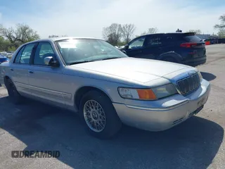 1999 Mercury Grand Marquis GS z VIN 2MEFM74W4XX684311, wystawiony jako IAAI lot #39150989 z przebiegiem 152 791 mil mil oraz . Historia ofert i sprzedaży dostępna na DreamBid. Obrazek 1.
