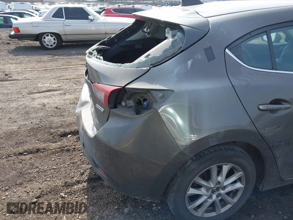 2014 Mazda 3 i Grand Touring with VIN JM1BM1M75E1207754, listed as a IAAI auction lot 41698583 with 128,887 mi miles and . Bid and sale history available at DreamBid. Image 17.