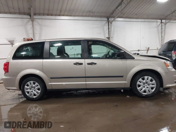 2015 Dodge Grand Caravan SE with VIN 2C4RDGBG2FR592899, listed as a IAAI auction lot 41309499 with 110,428 mi miles and . Bid and sale history available at DreamBid. Image 13.