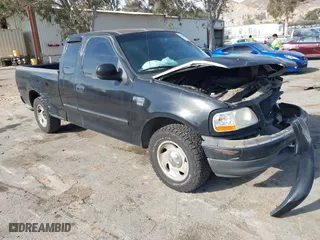 1999 Ford F-150 Work Series with VIN 1FTRX17W0XKB65435, listed as a IAAI auction lot 41456957 with 273,556 mi miles. Bid and sale history available at carsss.com. Image 1.