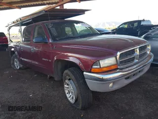 2002 Dodge Dakota SLT with VIN 1B7HG48N72S697907, listed as a IAAI auction lot 41866346 with 169,120 mi miles. Bid and sale history available at carsss.com. Image 1.