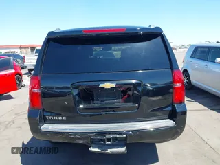 2015 Chevrolet Tahoe LTZ z VIN 1GNSKCKC7FR715512, wystawiony jako IAAI lot #42054583 z przebiegiem 106 941 mil mil oraz . Historia ofert i sprzedaży dostępna na DreamBid. Obrazek 16.
