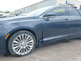2013 Lincoln MKZ z VIN 3LN6L2G90DR827936, wystawiony jako IAAI lot #42259036 z przebiegiem 145 304 mil mil oraz . Historia ofert i sprzedaży dostępna na DreamBid. Obrazek 6.
