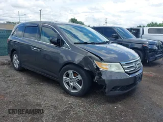 2013 Honda Odyssey Touring with VIN 5FNRL5H91DB025219, listed as a IAAI auction lot 42547186 with 142,777 mi miles and . Bid and sale history available at DreamBid. Image 1.