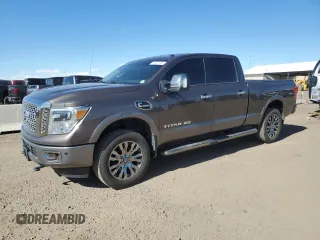 2017 Nissan Titan Pro-4X z VIN 1N6BA1F42HN543528, wystawiony jako Copart lot #57901595 z przebiegiem 82 423 mil mil oraz Tytuł czysty. Historia ofert i sprzedaży dostępna na DreamBid. Obrazek 1.