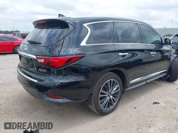 2020 Infiniti QX60 Pure with VIN 5N1DL0MM3LC524411, listed as a IAAI auction lot 42292734 with 51,221 mi miles and . Bid and sale history available at DreamBid. Image 4.