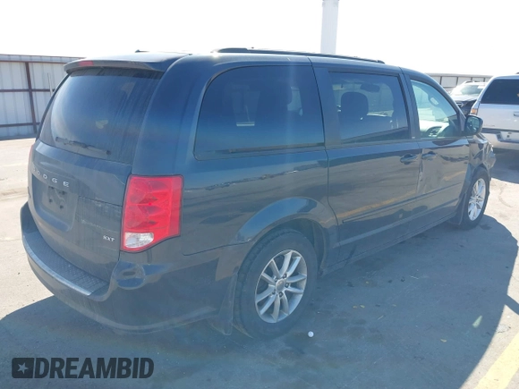 2014 Dodge Grand Caravan SXT with VIN 2C4RDGCG1ER167624, listed as a IAAI auction lot 41888822 with 202,729 mi miles and . Bid and sale history available at DreamBid. Image 4.