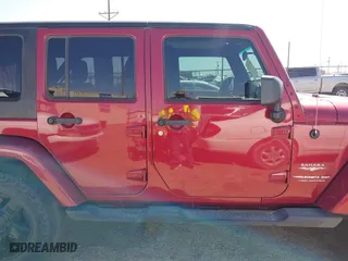2011 Jeep Wrangler Unlimited Sahara with VIN 1J4BA5H15BL557871, listed as a IAAI auction lot 41922328 with 206,581 mi miles. Bid and sale history available at carsss.com. Image 14.