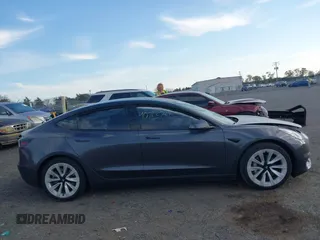 2021 Tesla Model 3 Long Range with VIN 5YJ3E1EB6MF975916, listed as a IAAI auction lot 40713749 with 29,593 mi miles and . Bid and sale history available at DreamBid. Image 12.