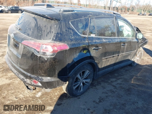 2018 Toyota RAV4 XLE with VIN 2T3RFREV2JW811214, listed as a IAAI auction lot 41458588 with 236,346 mi miles. Bid and sale history available at carsss.com. Image 4.
