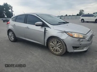 2017 Ford Focus Titanium with VIN 1FADP3N27HL251297, listed as a Copart auction lot 67373094 with 104,733 mi miles and Salvage Title. Bid and sale history available at carsss.com. Image 4.
