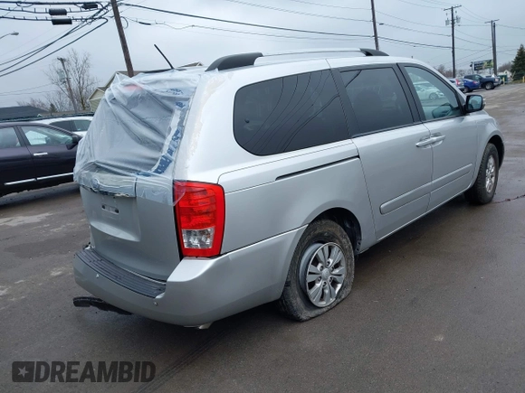 2012 Kia Sedona LX with VIN KNDMG4C72C6485952, listed as a IAAI auction lot 42029147 with 129,296 mi miles. Bid and sale history available at carsss.com. Image 4.