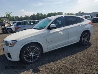 2016 BMW X4 xDrive28i with VIN 5UXXW3C54G0M90022, listed as a Copart auction lot 63077795 with 74,104 mi miles and Salvage title. Bid and sale history available at DreamBid. Image 1.