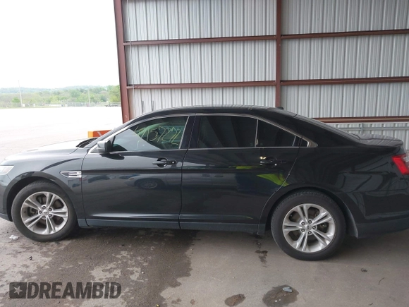 2015 Ford Taurus SEL z VIN 1FAHP2E86FG165100, wystawiony jako IAAI lot #42157272 z przebiegiem 141 846 mil mil oraz . Historia ofert i sprzedaży dostępna na DreamBid. Obrazek 14.