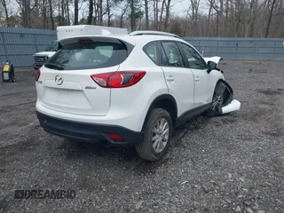 2014 Mazda CX-5 Sport with VIN JM3KE4BE3E0300849, listed as a IAAI auction lot 41942418 with 144,310 mi miles. Bid and sale history available at carsss.com. Image 4.