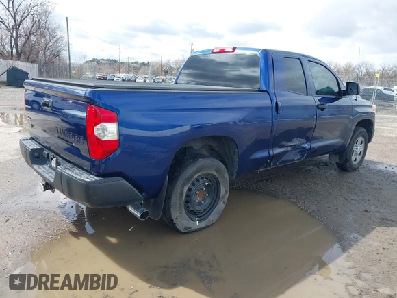 2014 Toyota Tundra SR with VIN 5TFUM5F17EX056082, listed as a IAAI auction lot 41884095 with 155,036 mi miles and . Bid and sale history available at DreamBid. Image 4.