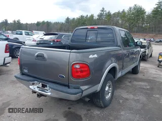 2003 Ford F-150 XLT with VIN 1FTRW08L63KA37275, listed as a IAAI auction lot 41875128 with 133,257 mi miles. Bid and sale history available at carsss.com. Image 4.