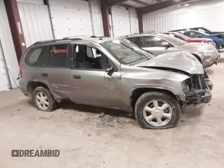 2005 GMC Envoy SLT with VIN 1GKDT13S352257892, listed as a IAAI auction lot 41690880 with 134,216 mi miles. Bid and sale history available at carsss.com. Image 13.