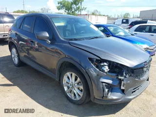 2014 Mazda CX-5 Grand Touring with VIN JM3KE2DY8E0383206, listed as a IAAI auction lot 40205756 with 120,231 mi miles. Bid and sale history available at carsss.com. Image 1.