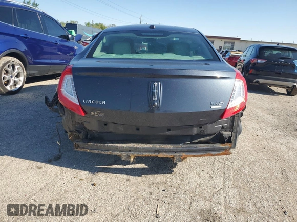 2014 Lincoln MKS EcoBoost z VIN 1LNHL9FT8EG607807, wystawiony jako Copart lot #57755915 z przebiegiem 203 316 mil mil oraz Szkoda całkowita • Salvage title. Historia ofert i sprzedaży dostępna na DreamBid. Obrazek 6.