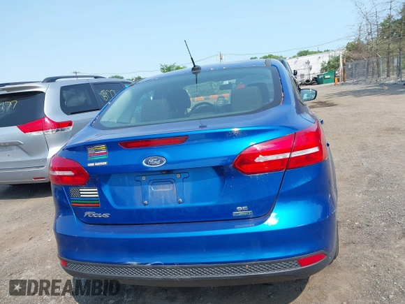 2018 Ford Focus SE z VIN 1FADP3FE1JL254632, wystawiony jako IAAI lot #42408683 z przebiegiem 74 696 mil mil oraz . Historia ofert i sprzedaży dostępna na DreamBid. Obrazek 16.