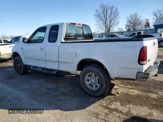 1997 Ford F-150 XL with VIN 1FTDX1866VKB08985, listed as a Copart auction lot 43708935 with 208,670 mi miles and Salvage title. Bid and sale history available at DreamBid. Image 2.