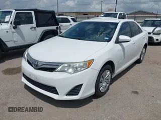 2014 Toyota Camry L with VIN 4T4BF1FK2ER375590, listed as a IAAI auction lot 42101553 with 126,849 mi miles and . Bid and sale history available at DreamBid. Image 17.