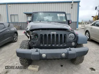2015 Jeep Wrangler Unlimited Willys Wheeler with VIN 1C4BJWDG3FL601197, listed as a Copart auction lot 53832465 with 216,141 mi miles and Salvage Title. Bid and sale history available at DreamBid. Image 5.