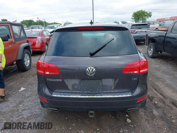 2012 Volkswagen Touareg Sport with VIN WVGFK9BP0CD002939, listed as a IAAI auction lot 42531654 with 222,435 mi miles and . Bid and sale history available at DreamBid. Image 16.
