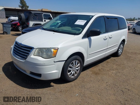 2009 Chrysler Town & Country LX with VIN 2A8HR44E79R549129, listed as a IAAI auction lot 42079369 with 102,805 mi miles. Bid and sale history available at carsss.com. Image 2.