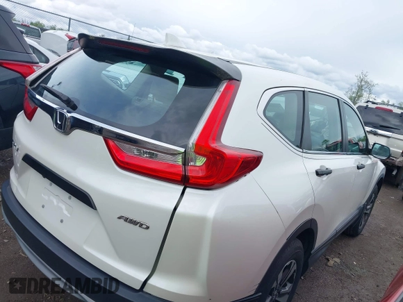 2018 Honda CR-V LX z VIN 2HKRW6H37JH215564, wystawiony jako IAAI lot #42191977 z przebiegiem 90 994 mil mil oraz . Historia ofert i sprzedaży dostępna na DreamBid. Obrazek 4.
