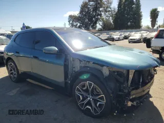 2023 BMW iX M60 with VIN WB533CF01PCM82043, listed as a Copart auction lot 47447815 with 9,058 mi miles and Salvage Title. Bid and sale history available at carsss.com. Image 4.