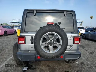 2019 Jeep Wrangler Unlimited Sahara with VIN 1C4HJXEN0KW616942, listed as a Copart auction lot 63501755 with 57,095 mi miles and Salvage title. Bid and sale history available at DreamBid. Image 6.