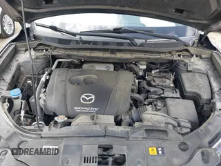 2016 Mazda CX-5 Touring with VIN JM3KE2CYXG0647921, listed as a IAAI auction lot 41948068 with 133,733 mi miles and . Bid and sale history available at DreamBid. Image 10.