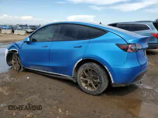 2021 Tesla Model Y Long Range z VIN 5YJYGDEE6MF239571, wystawiony jako Copart lot #56433595 z przebiegiem 58 471 mil mil oraz Szkoda całkowita • Salvage title. Historia ofert i sprzedaży dostępna na DreamBid. Obrazek 2.
