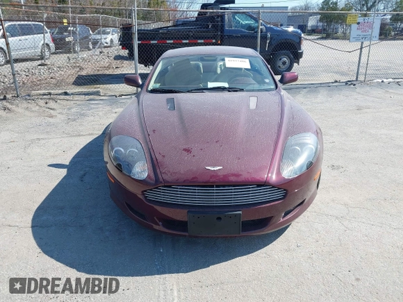 2005 Aston Martin DB9 z VIN SCFAD01A75GA01262, wystawiony jako IAAI lot #41937486 z przebiegiem 35 538 mil mil oraz . Historia ofert i sprzedaży dostępna na DreamBid. Obrazek 12.