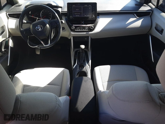 2022 Toyota Corolla Cross LE with VIN 7MUCAABG1NV033299, listed as a Copart auction lot 58018825 with 28,138 mi miles and Salvage title. Bid and sale history available at DreamBid. Image 8.