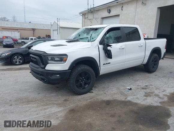 2022 Ram 1500 Rebel z VIN 1C6SRFLT1NN267513, wystawiony jako IAAI lot #41961821 z przebiegiem 140 488 mil mil oraz . Historia ofert i sprzedaży dostępna na DreamBid. Obrazek 19.