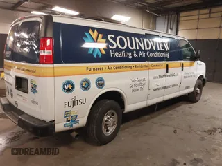 2020 Chevrolet Express Cargo Van with VIN 1GCWGBFB4L1205443, listed as a IAAI auction lot 41612714 with 87,883 mi miles. Bid and sale history available at carsss.com. Image 4.