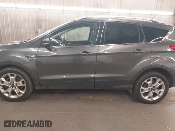 2015 Ford Escape Titanium with VIN 1FMCU9J96FUA43337, listed as a IAAI auction lot 41825328 with 149,639 mi miles and . Bid and sale history available at DreamBid. Image 15.