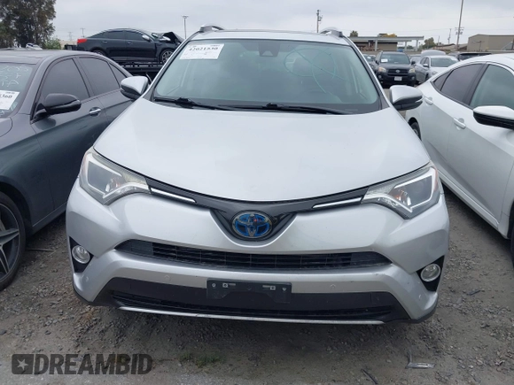 2016 Toyota RAV4 Hybrid XLE with VIN JTMRJREVXGD029019, listed as a IAAI auction lot 42021530 with 74,400 mi miles. Bid and sale history available at carsss.com. Image 13.