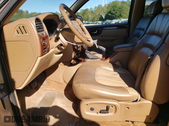 2002 GMC Envoy SLT with VIN 1GKDT13S022456264, listed as a Copart auction lot 76556004 with 230,954 mi miles and Salvage Title. Bid and sale history available at DreamBid. Image 7.