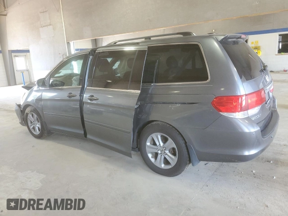 2010 Honda Odyssey Touring with VIN 5FNRL3H91AB113770, listed as a Copart auction lot 61893115 with 155,776 mi miles and Salvage title. Bid and sale history available at DreamBid. Image 2.