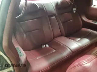 1992 Cadillac Eldorado z VIN 1G6EL13B8NU614555, wystawiony jako Copart lot #73767514 z przebiegiem 88 448 mil mil oraz Tytuł czysty. Historia ofert i sprzedaży dostępna na DreamBid. Obrazek 10.