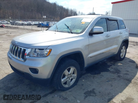 2013 Jeep Grand Cherokee Laredo with VIN 1C4RJFAG5DC634685, listed as a IAAI auction lot 41792147 with 260,594 mi miles. Bid and sale history available at carsss.com. Image 2.