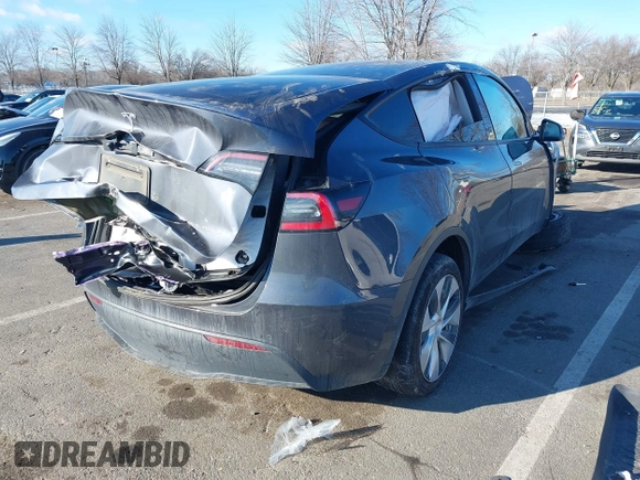2020 Tesla Model Y Long Range with VIN 5YJYGDEE4LF030103, listed as a IAAI auction lot 41328929 with 64,896 mi miles and . Bid and sale history available at DreamBid. Image 4.
