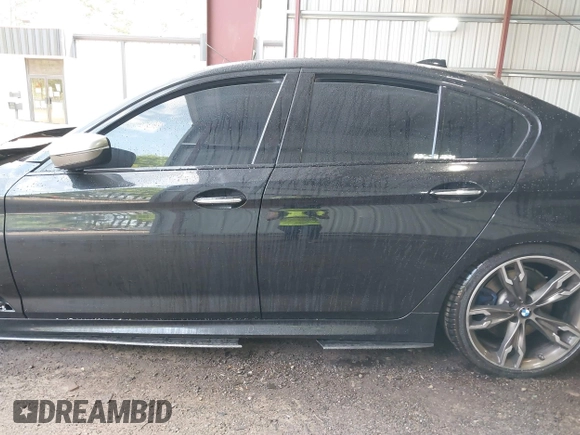 2018 BMW 5 Series M550i xDrive with VIN WBAJB9C51JB035949, listed as a IAAI auction lot 42085727 with Not provided miles and . Bid and sale history available at DreamBid. Image 13.