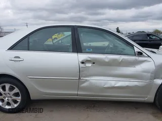 2005 Toyota Camry LE with VIN JTDBF30K650163057, listed as a IAAI auction lot 41730270 with 98,300 mi miles and . Bid and sale history available at DreamBid. Image 13.