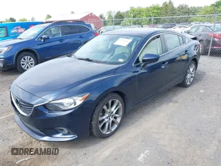 2015 Mazda 6 i Grand Touring with VIN JM1GJ1W53F1200121, listed as a IAAI auction lot 42173036 with 76,184 mi miles and . Bid and sale history available at DreamBid. Image 2.